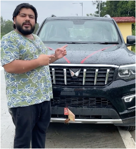 Kaushal Amann looks his car