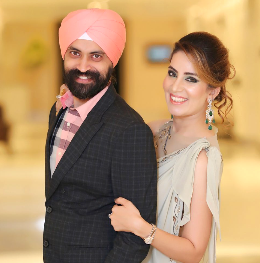 Ramneek engaged in a business, posing for a photo